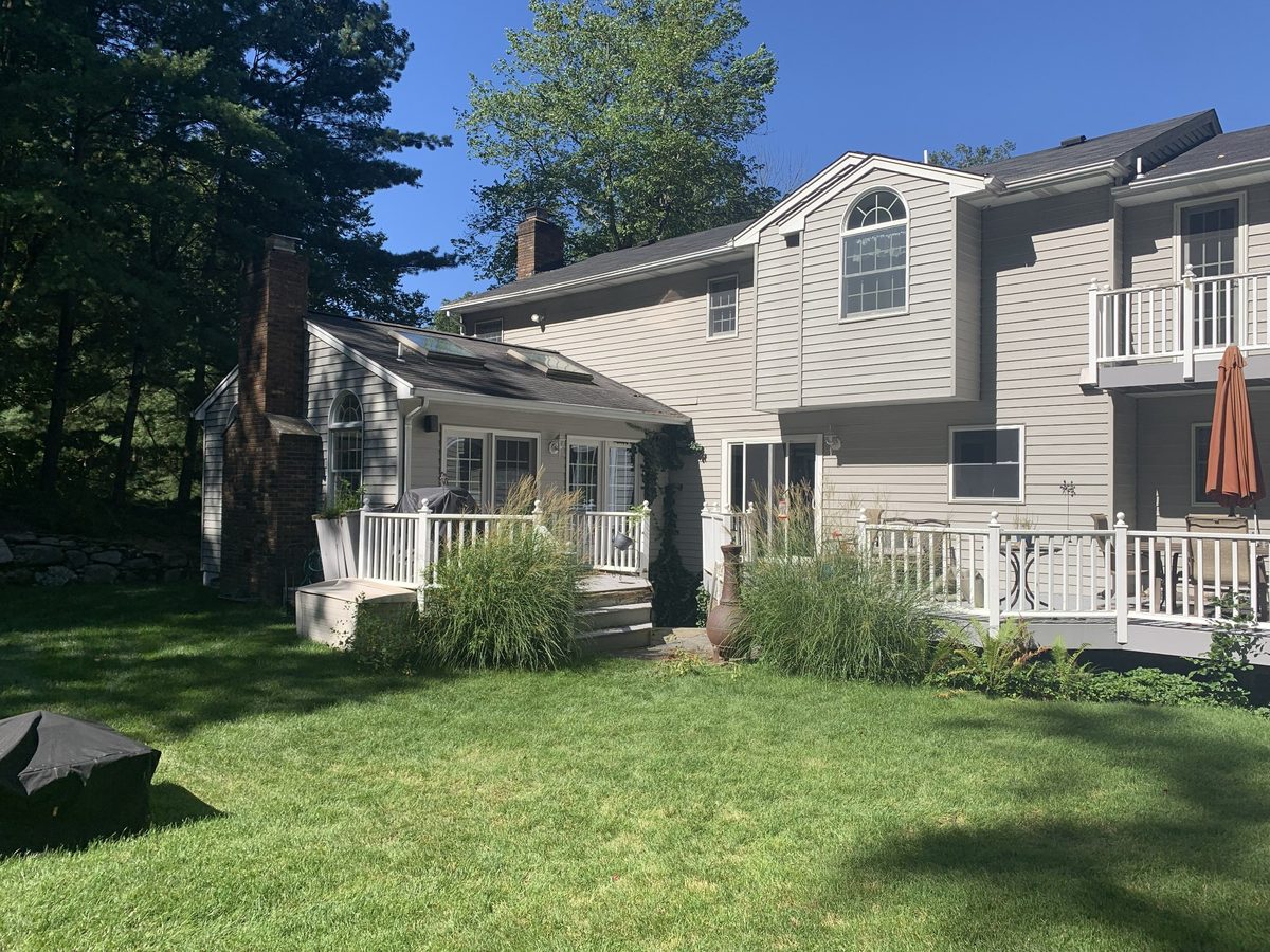 Before outdoor living renovation image showing deck and underused backyard at a Ringwood NJ property